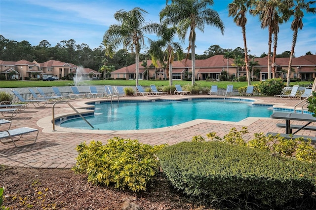 view of swimming pool featuring a patio area