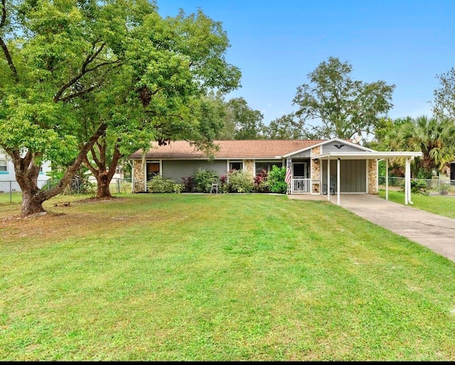 single story home with a front yard and a carport