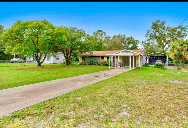 view of front of property featuring a carport and a front lawn