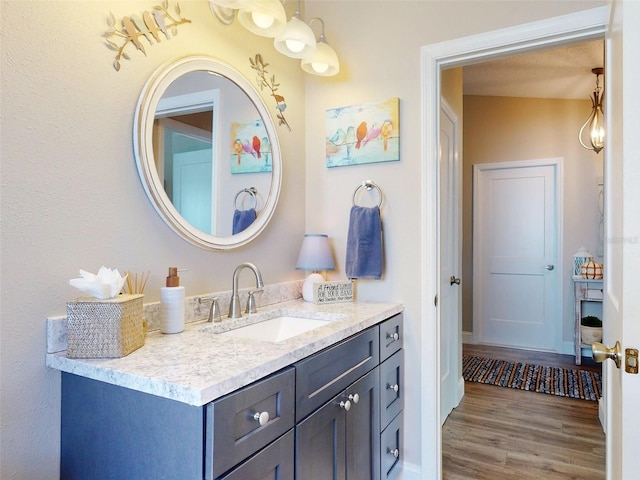 bathroom with vanity and hardwood / wood-style floors