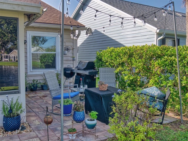 view of patio featuring a grill