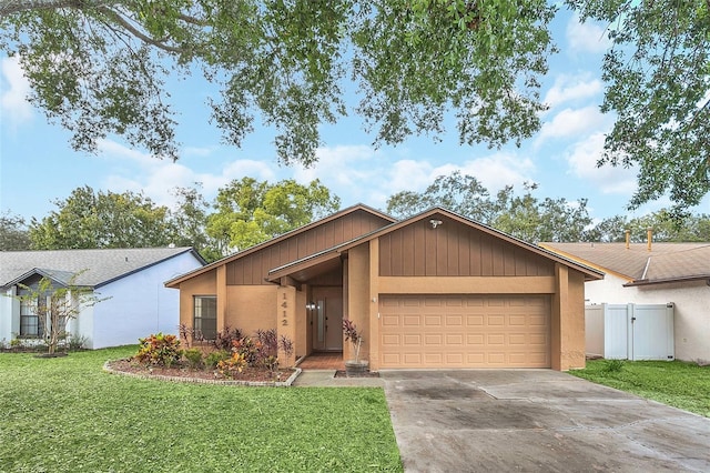 ranch-style home with a garage and a front yard