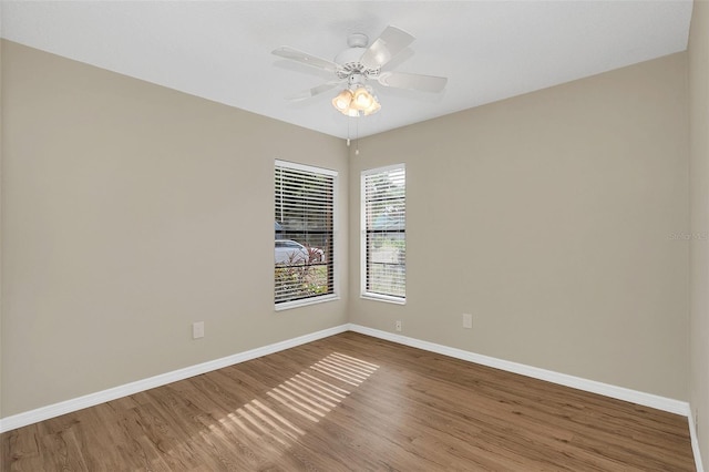 unfurnished room featuring hardwood / wood-style flooring and ceiling fan