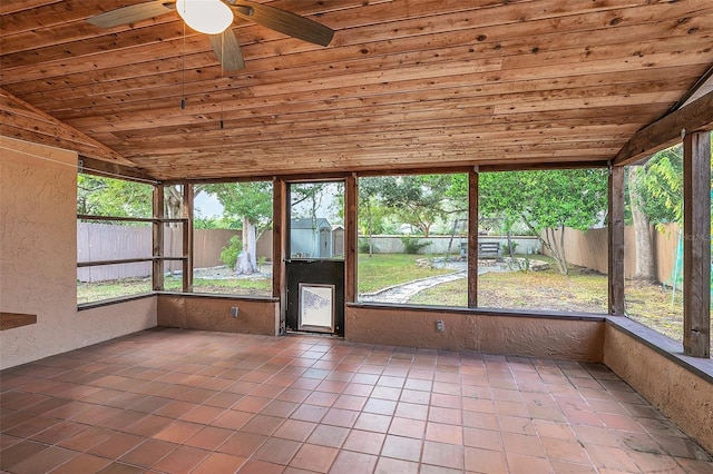 unfurnished sunroom with a wealth of natural light, ceiling fan, vaulted ceiling, and wooden ceiling