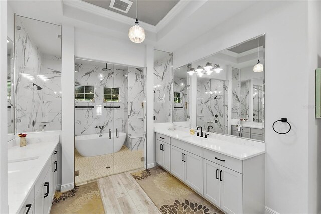 bathroom featuring vanity, hardwood / wood-style floors, crown molding, and plus walk in shower