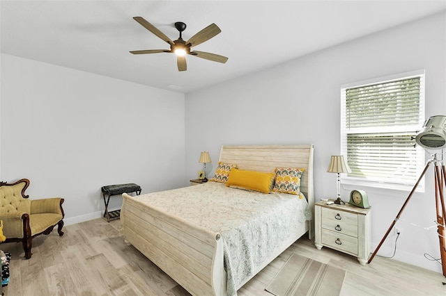 bedroom with ceiling fan and light wood-type flooring