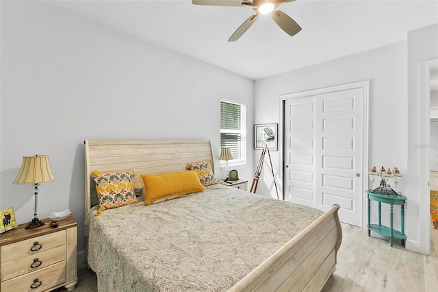 bedroom featuring a closet, ceiling fan, and light wood-type flooring