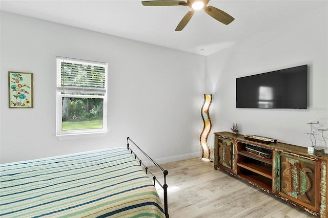 bedroom with ceiling fan and light hardwood / wood-style flooring