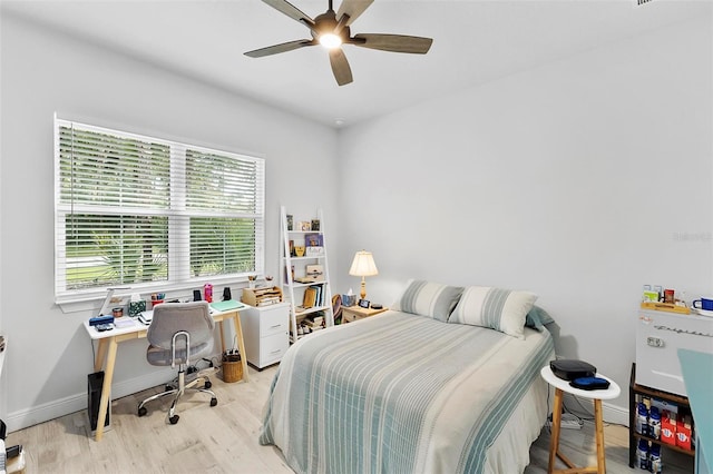 bedroom with ceiling fan and light wood-type flooring