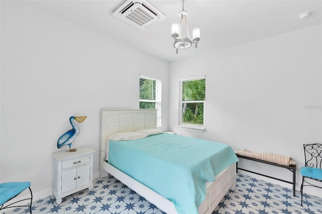 bedroom featuring a chandelier