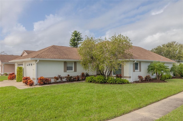 single story home with a garage and a front yard