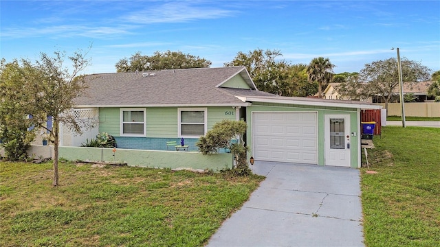 ranch-style house featuring a garage and a front yard