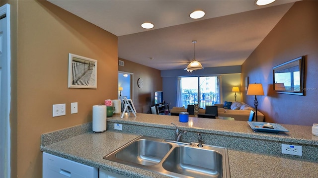 kitchen with pendant lighting, sink, and white dishwasher