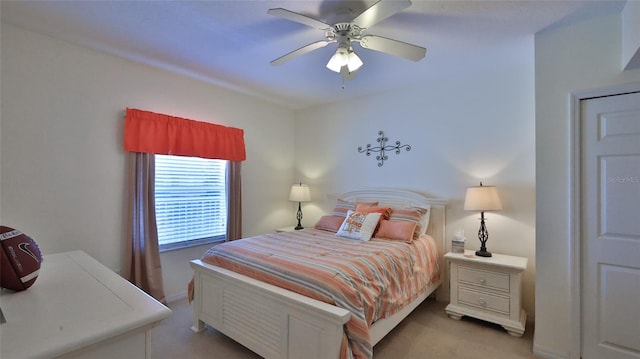 carpeted bedroom with ceiling fan