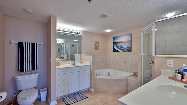 full bathroom with vanity, tile patterned flooring, a textured ceiling, and separate shower and tub