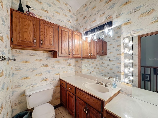 bathroom with tile patterned floors, vanity, and toilet