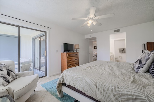 tiled bedroom with ensuite bathroom, a textured ceiling, ceiling fan, and access to exterior