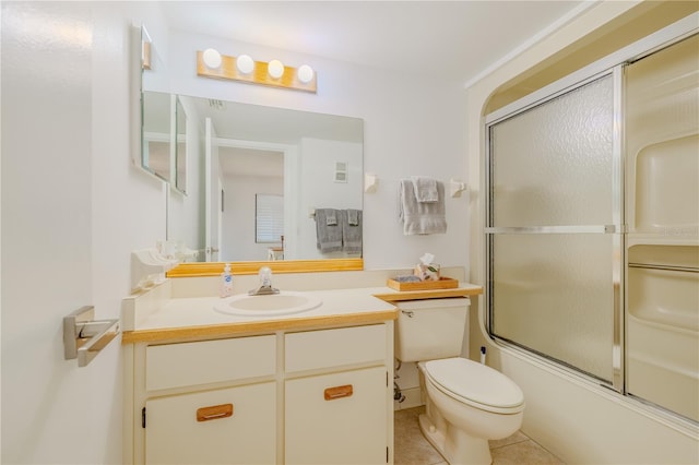 full bathroom featuring tile patterned flooring, enclosed tub / shower combo, toilet, and vanity