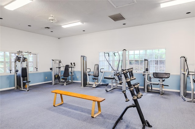 gym featuring a textured ceiling