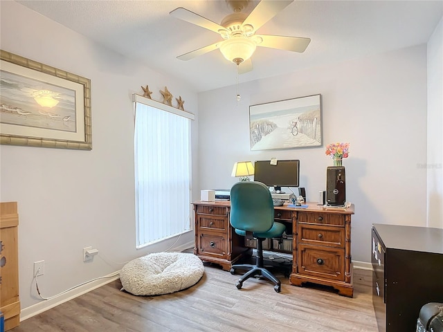 office area with light hardwood / wood-style floors and ceiling fan