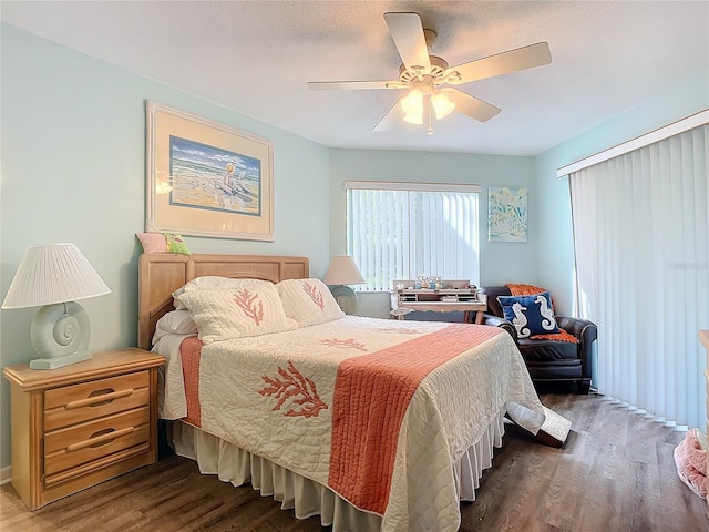 bedroom featuring dark hardwood / wood-style flooring and ceiling fan