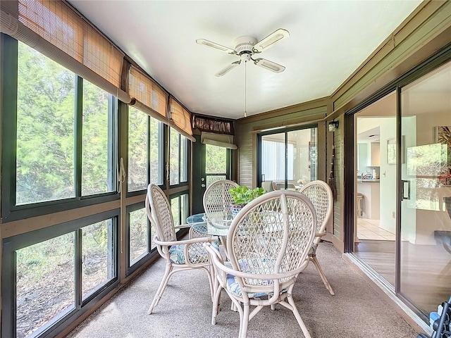 sunroom featuring plenty of natural light and ceiling fan