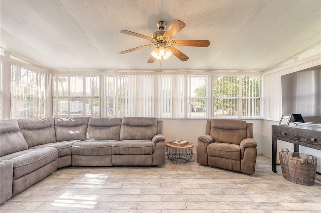 sunroom featuring ceiling fan, wood ceiling, and vaulted ceiling