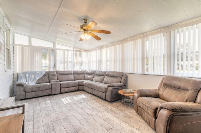 sunroom / solarium with vaulted ceiling, ceiling fan, and wood ceiling