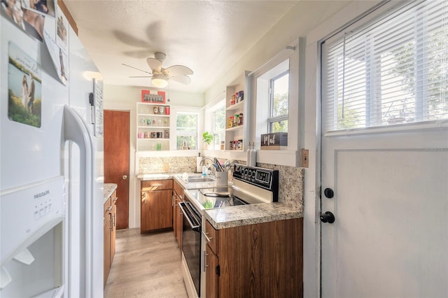 kitchen with electric stove, sink, light hardwood / wood-style flooring, ceiling fan, and white fridge with ice dispenser