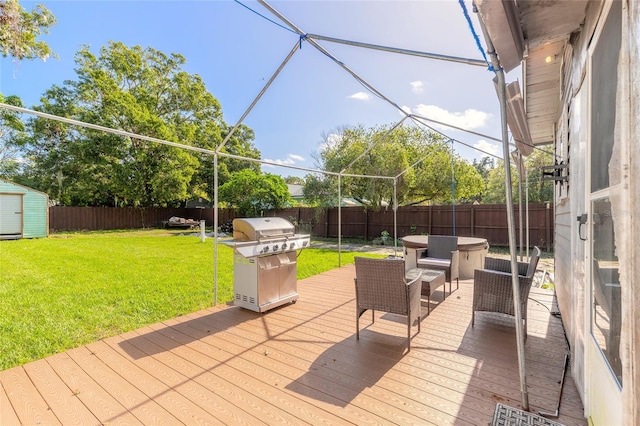 wooden terrace with a grill