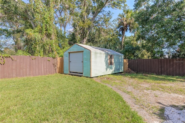 view of outbuilding featuring a yard