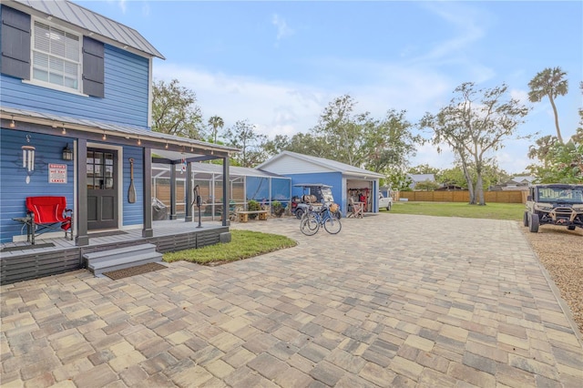 view of patio / terrace with an outbuilding