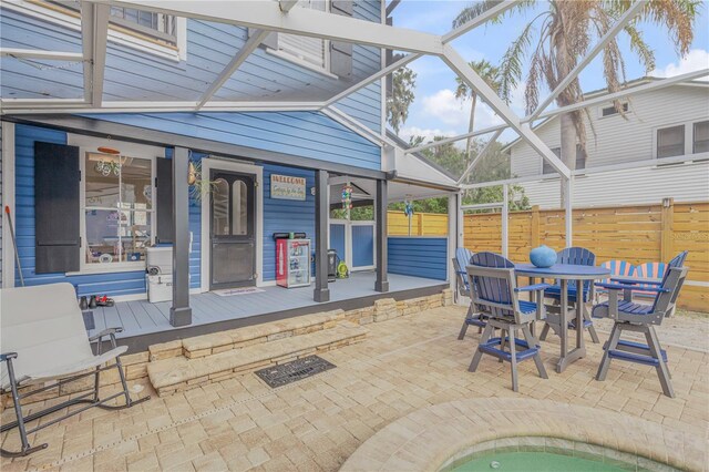 view of patio / terrace with a lanai