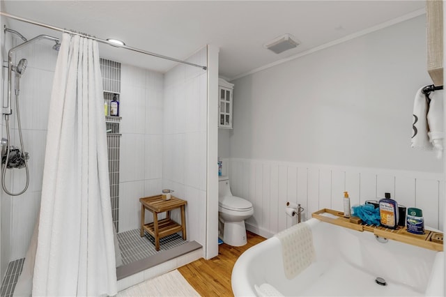 bathroom with ornamental molding, toilet, wood-type flooring, and a shower with shower curtain