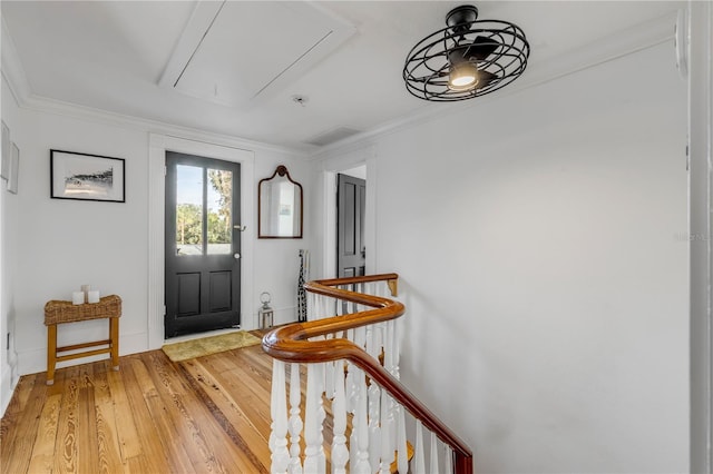 entrance foyer featuring hardwood / wood-style floors and crown molding