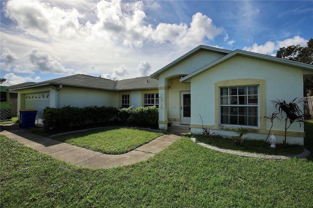 ranch-style house with a garage and a front yard