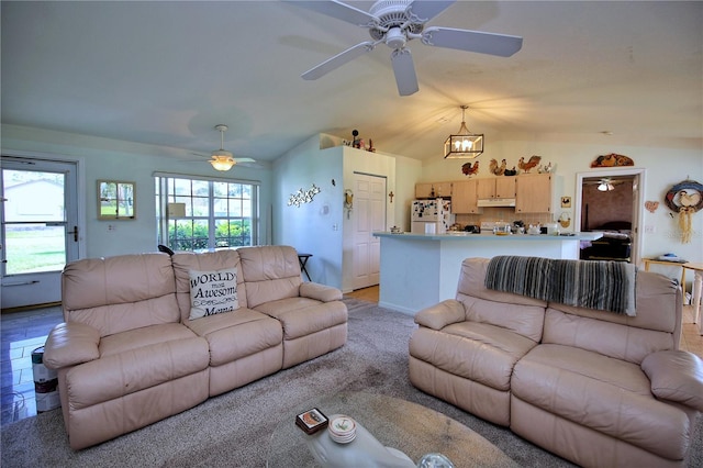 living room with ceiling fan with notable chandelier and lofted ceiling