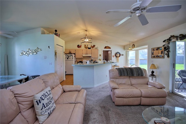 living room featuring light carpet, a wealth of natural light, lofted ceiling, and ceiling fan