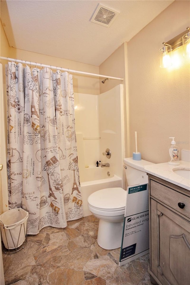 full bathroom featuring shower / tub combo with curtain, vanity, and toilet