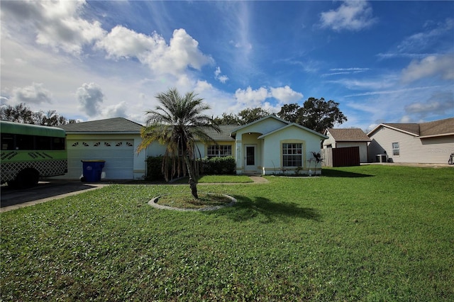 ranch-style home featuring a garage and a front lawn