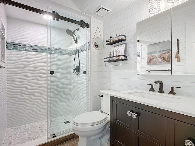 bathroom with wooden walls, vanity, an enclosed shower, and toilet