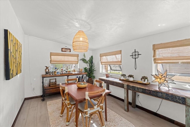 dining area featuring light wood-type flooring