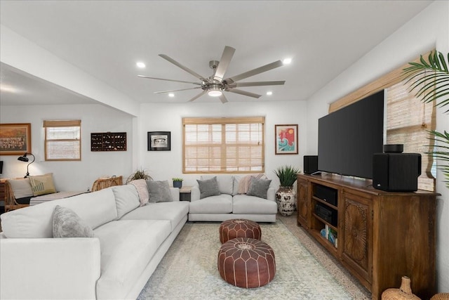 living room with plenty of natural light and ceiling fan