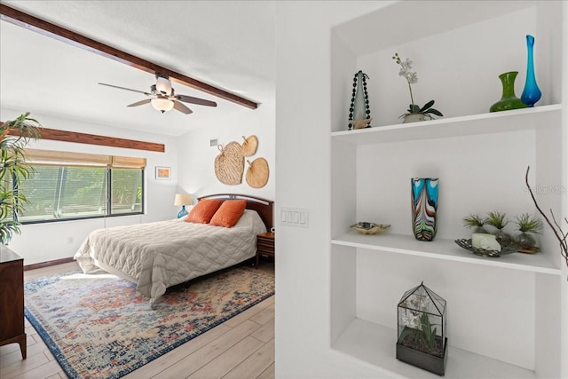 bedroom with ceiling fan and light hardwood / wood-style flooring