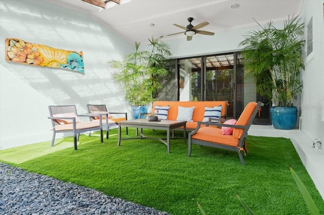 interior space featuring ceiling fan and an outdoor hangout area