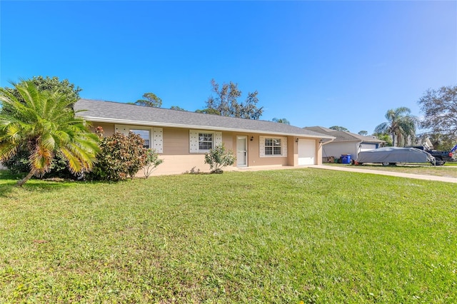 single story home featuring a front lawn and a garage