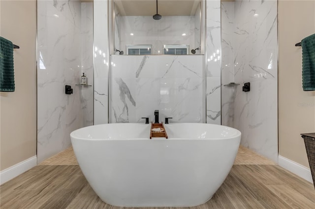 bathroom featuring separate shower and tub