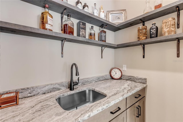 kitchen with sink and light stone counters