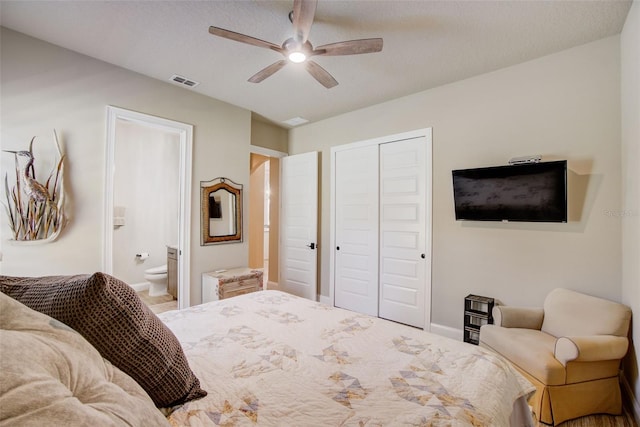 bedroom featuring a textured ceiling, a closet, ceiling fan, and connected bathroom