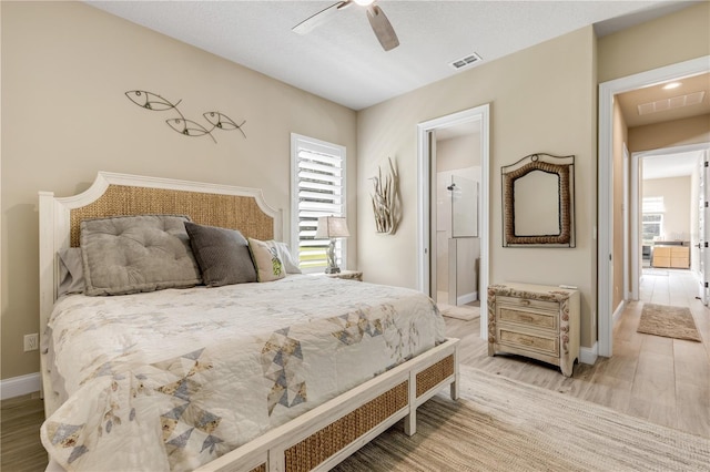 bedroom with light hardwood / wood-style floors and ceiling fan